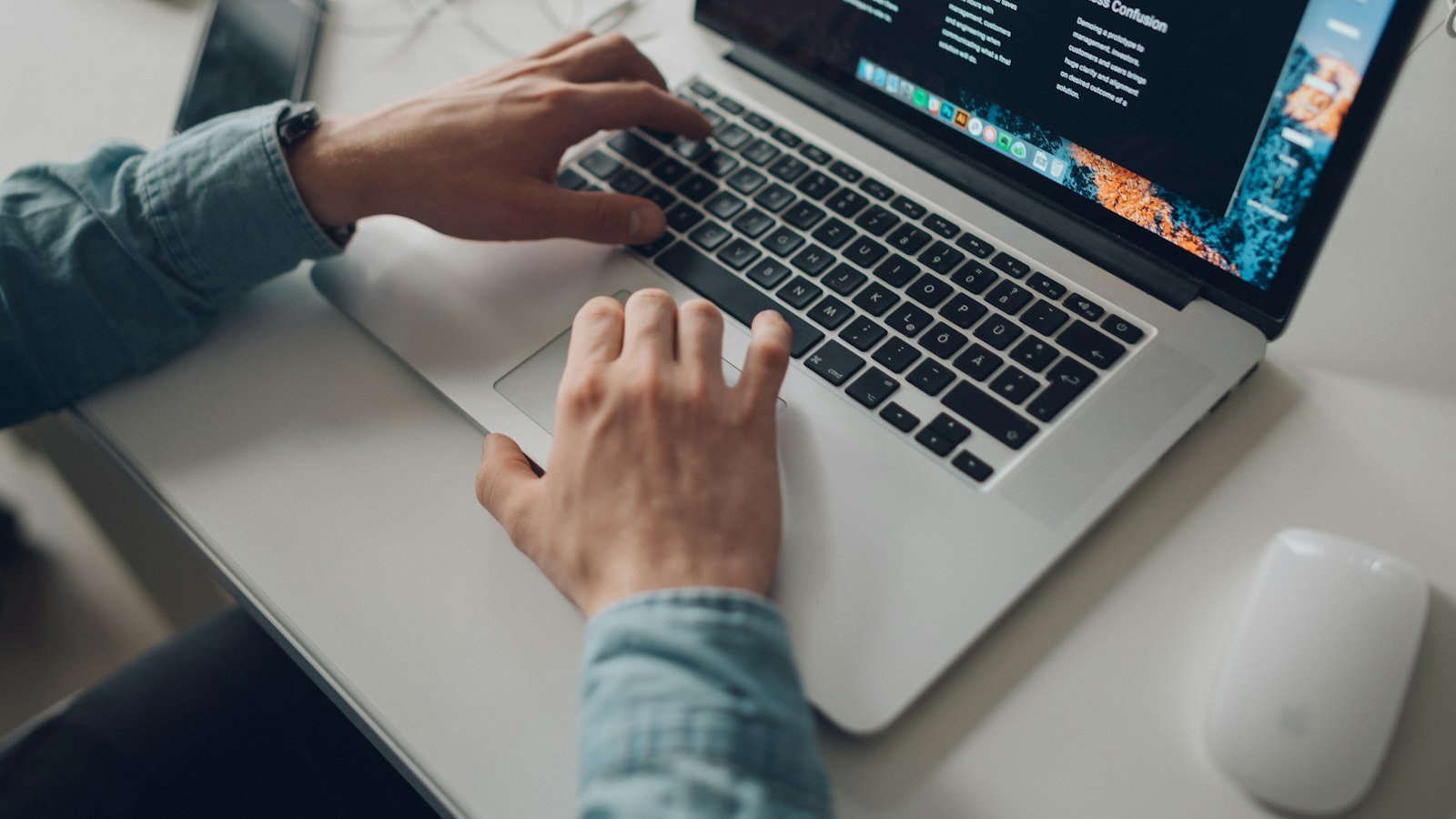 Advertise a business opportunity: person wearing long-sleeve top working on laptop