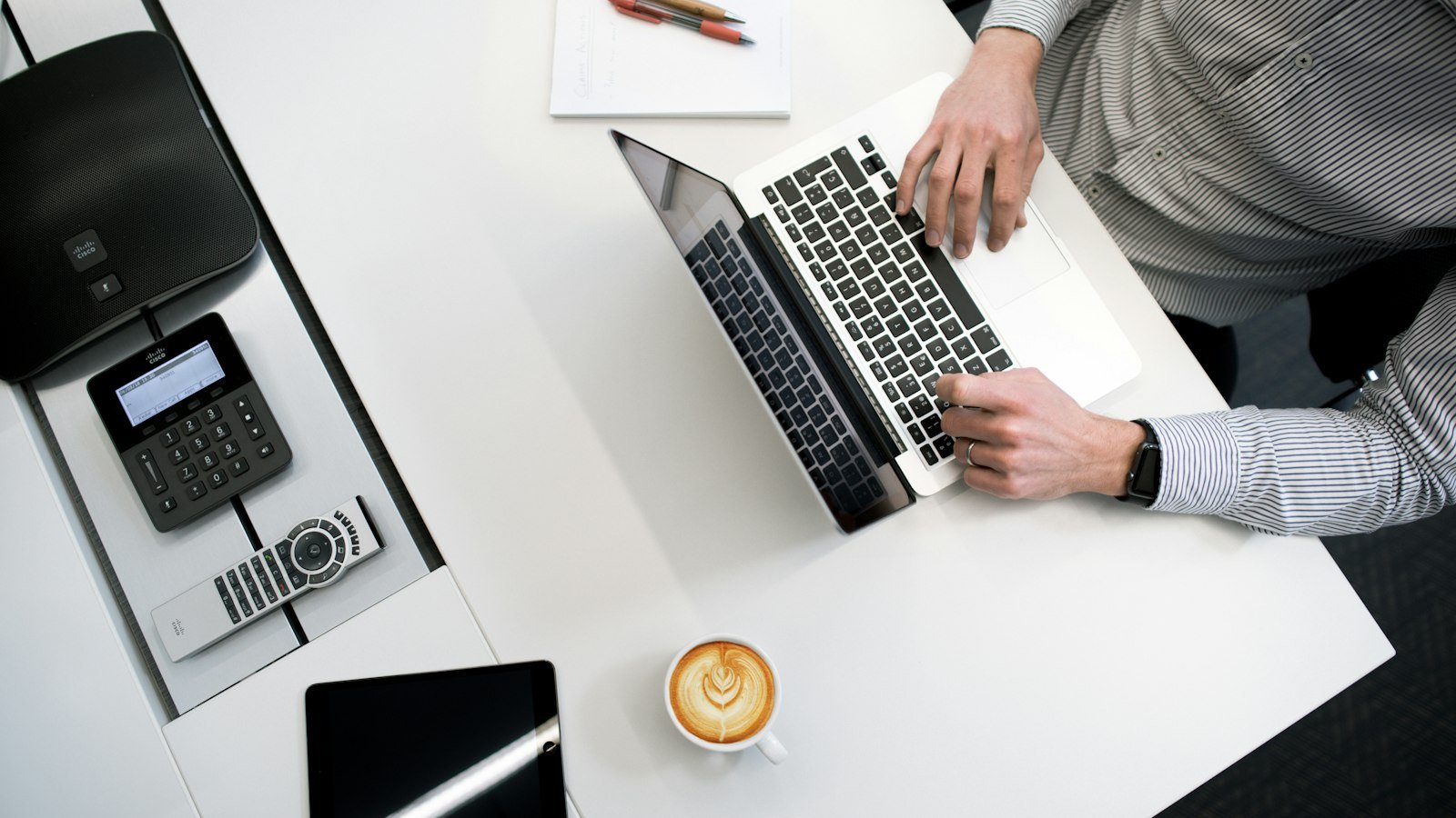 Asset sale vs stock sale: person using laptop on white wooden table