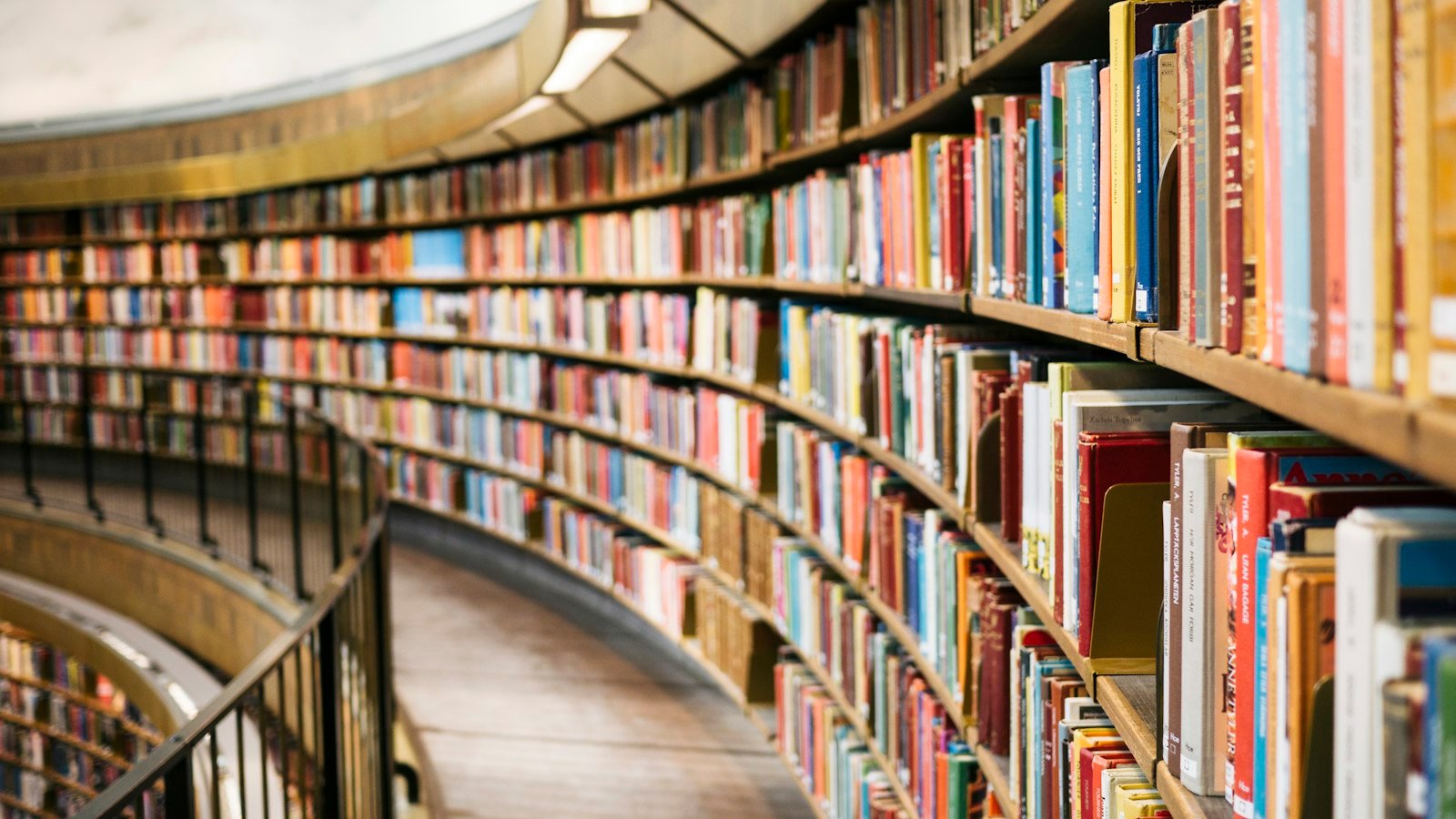 Audiobooks for entrepreneurs: books on brown wooden shelf