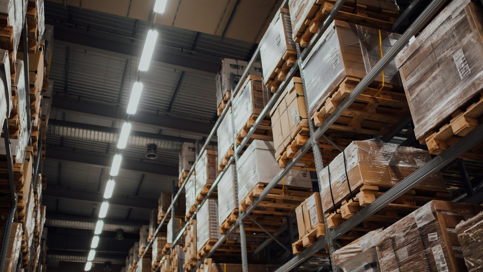 Become a distributor: brown cardboard boxes on white metal rack