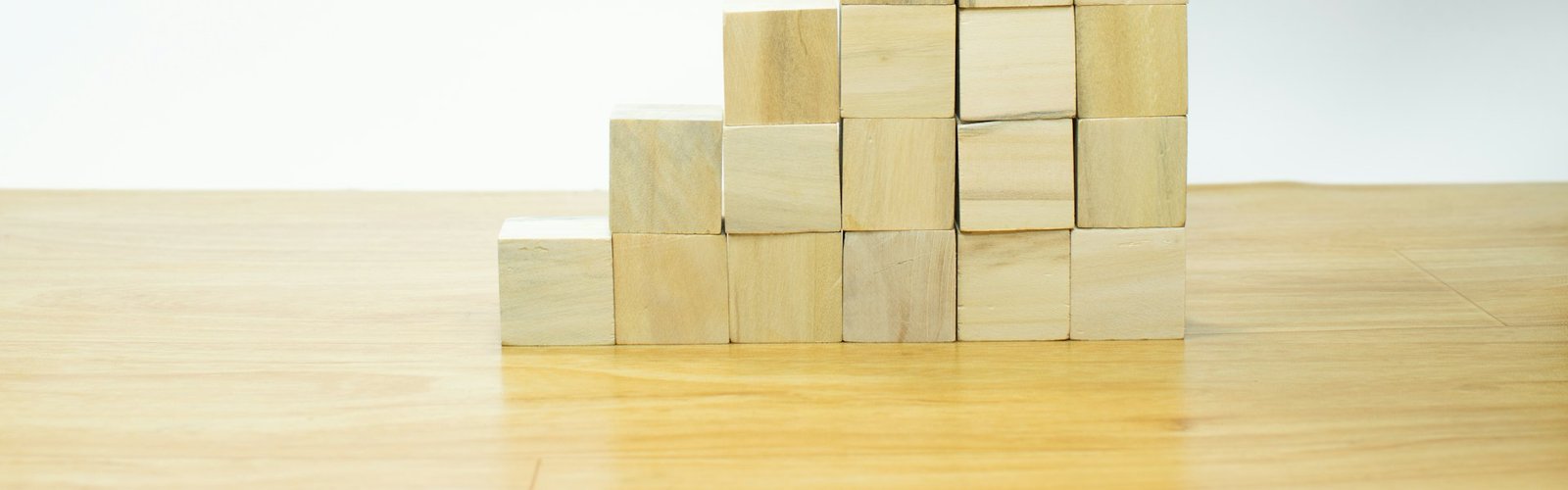 Wooden blocks stacked like a growth chart