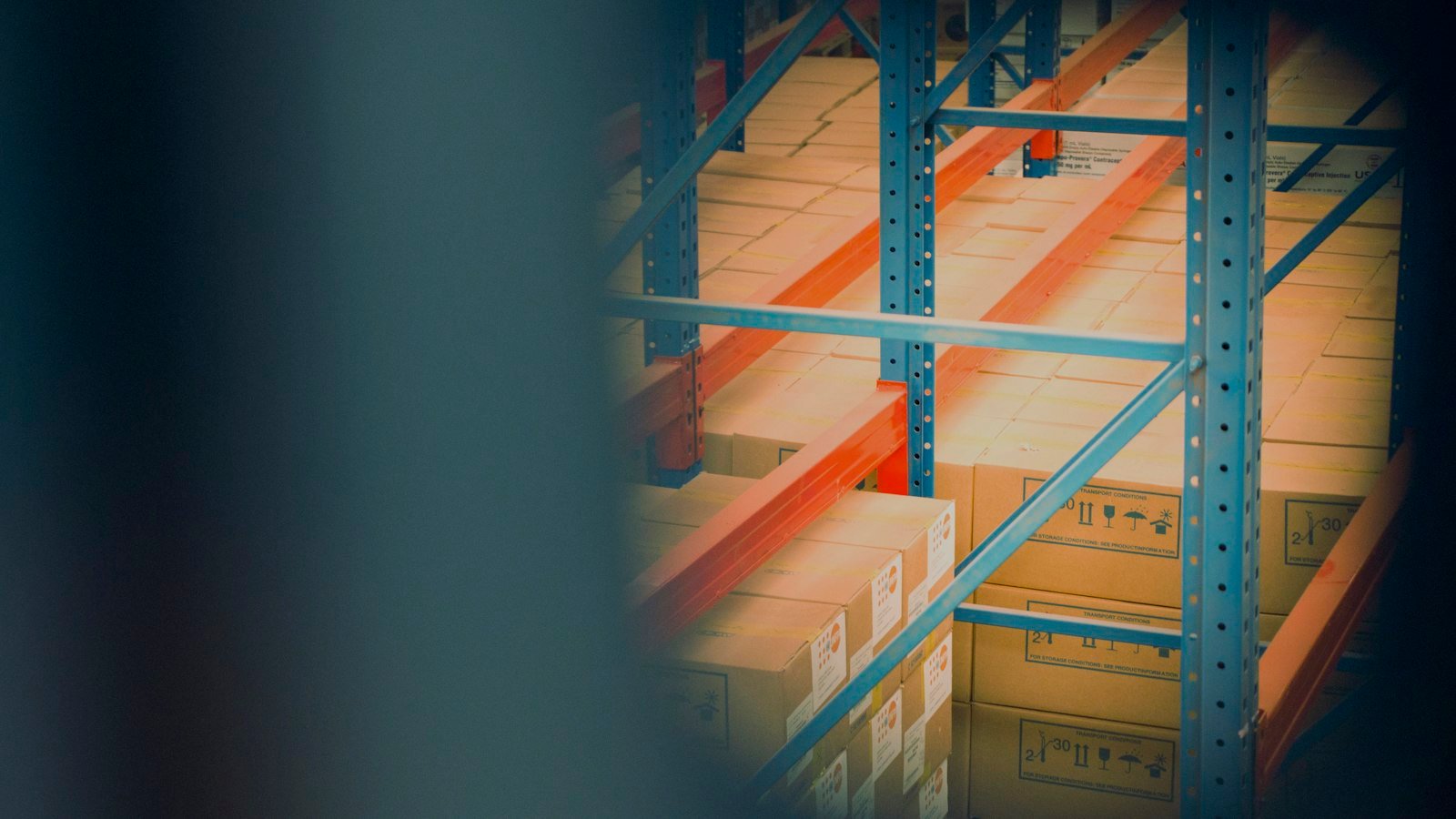 Buy a distributorship: selective focus photography of brown boxes on gray shelf