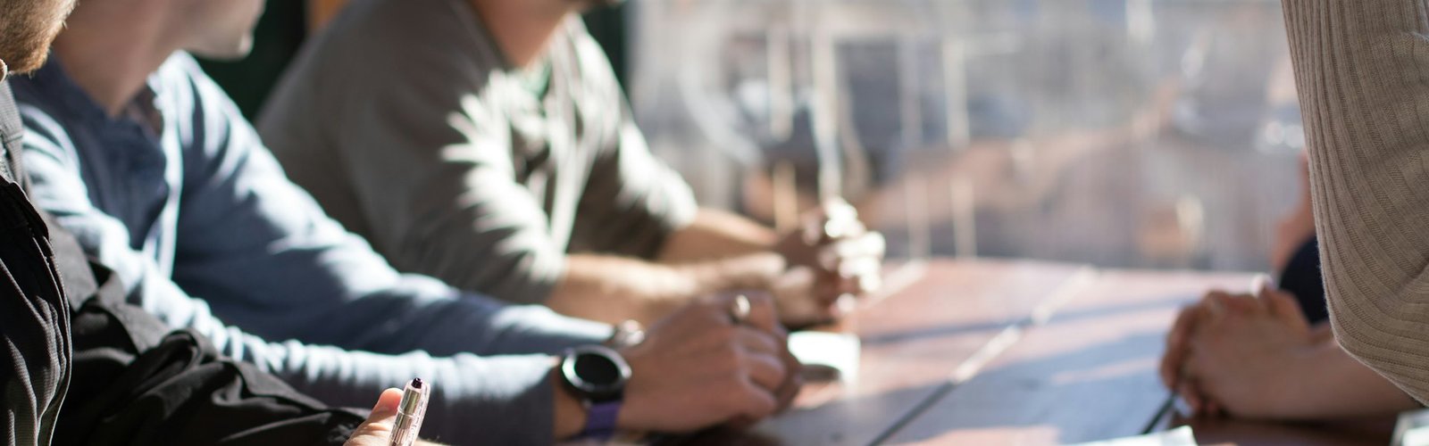 People in a business negotiation meeting at a table