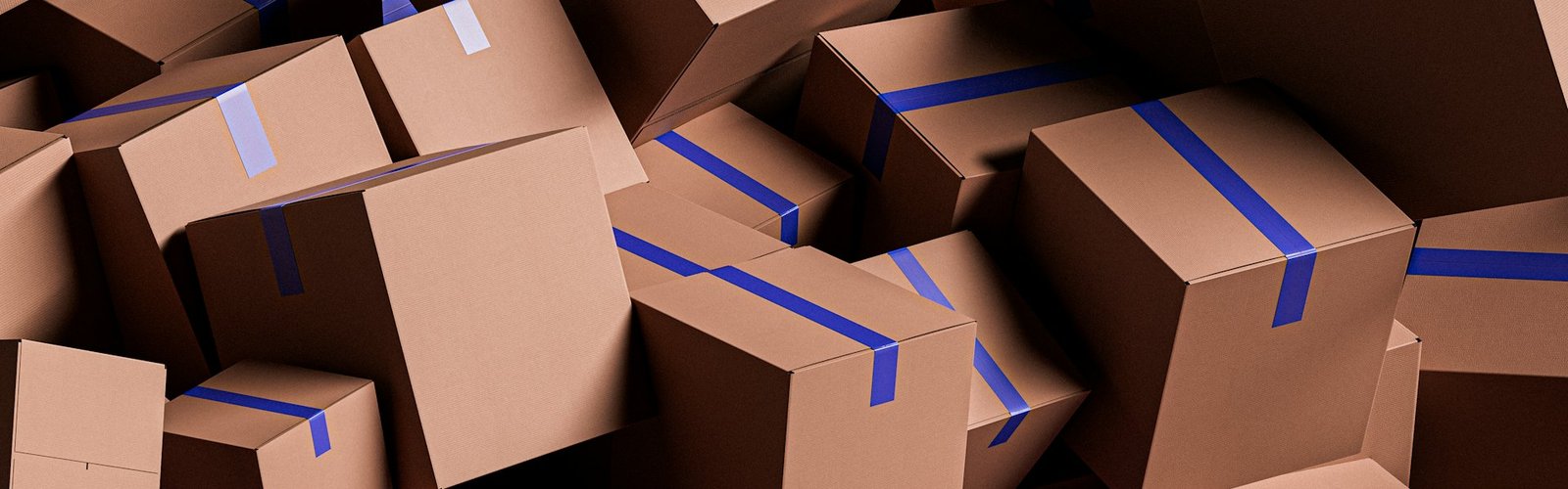 Ecommerce business opportunities: Large pile of brown cardboard shipping boxes sealed with blue tape