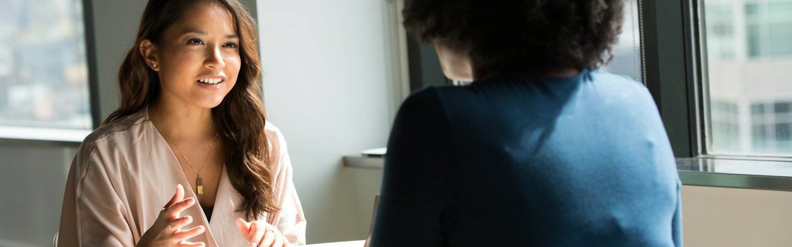 Two women talking in a mentoring conversation