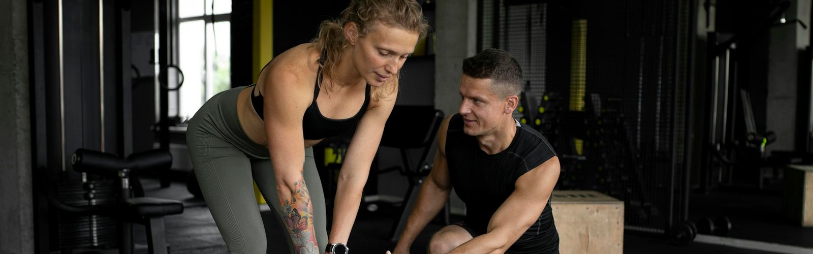 Fitness business opportunity: Personal trainer coaching a client in a gym