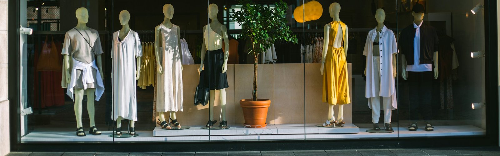 Mannequins in a clothing store window display