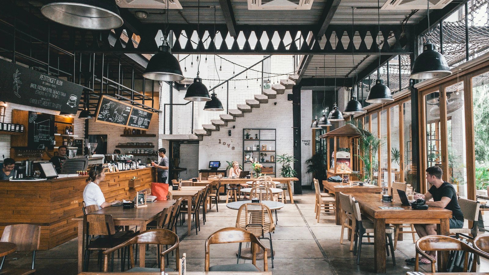 Franchise vs distributorship: interior of rustic cafe with wooden tables