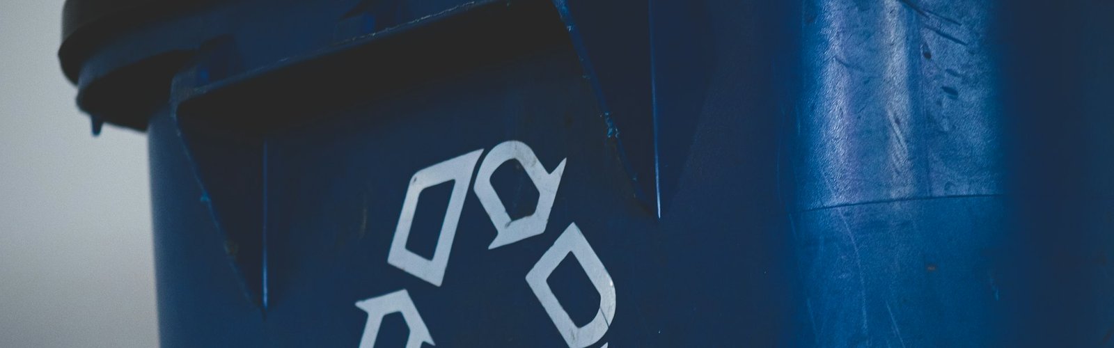 Green business opportunities: Blue recycling bin with the recycling symbol