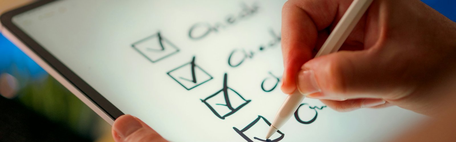 Evaluate a business opportunity: Hand checking boxes on a checklist