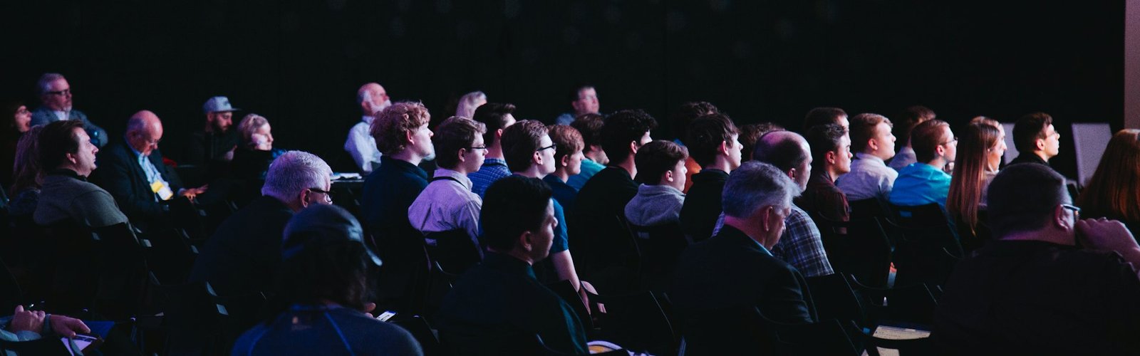 Crowd of attendees seated at a business networking event