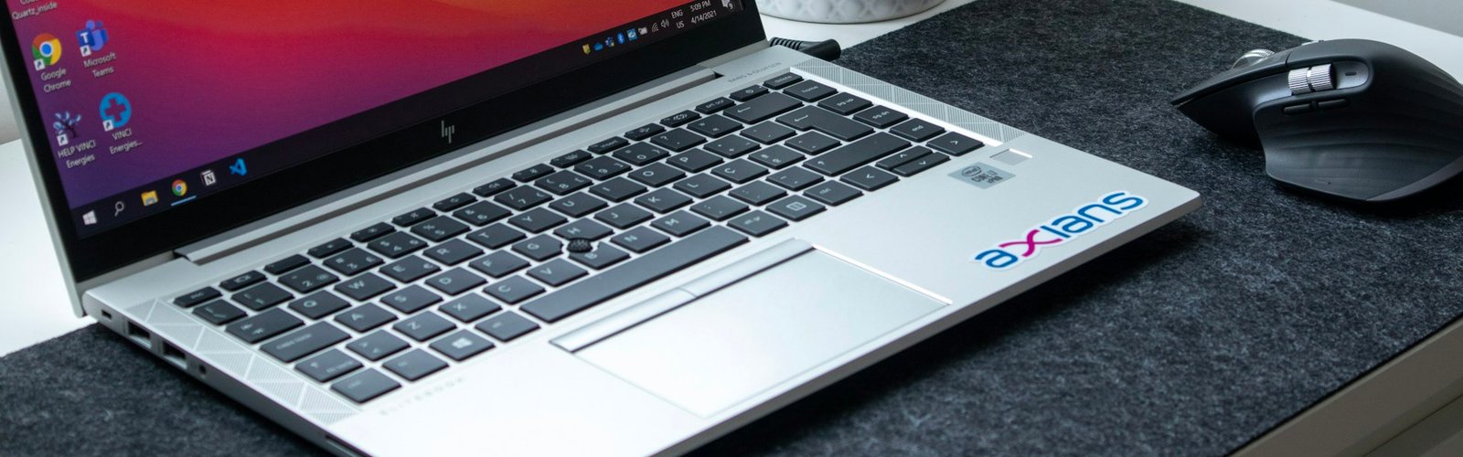 Home-based business opportunities: Silver laptop on a desk set up for a home-based business