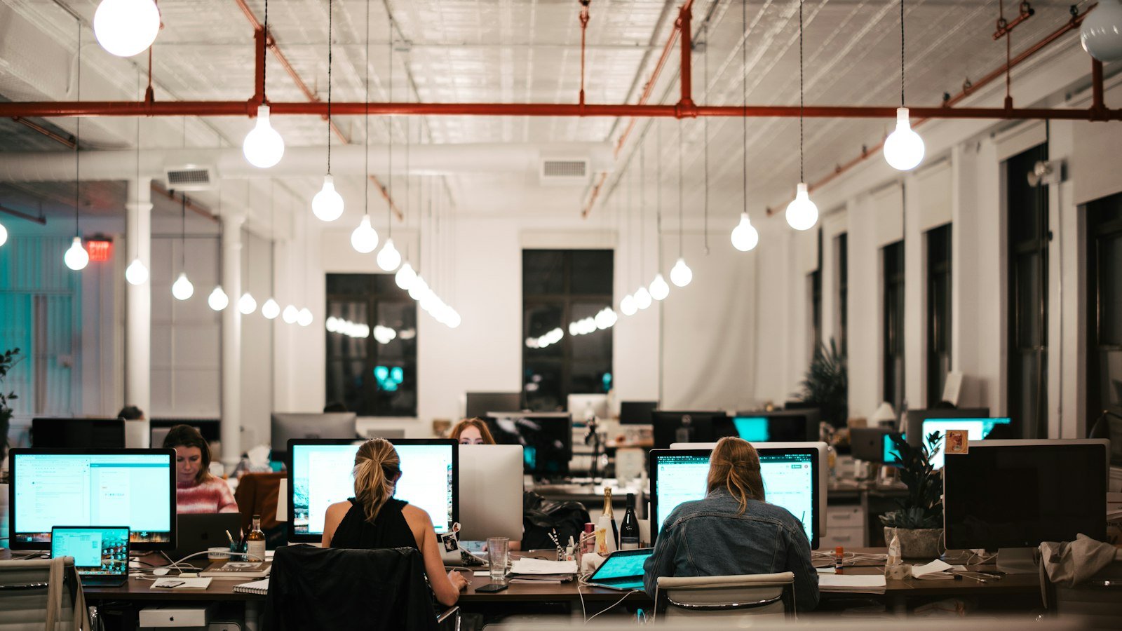 Open a business bank account: people sitting on chair in front of computer
