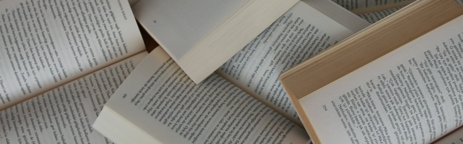 Open books with pages spread on a table