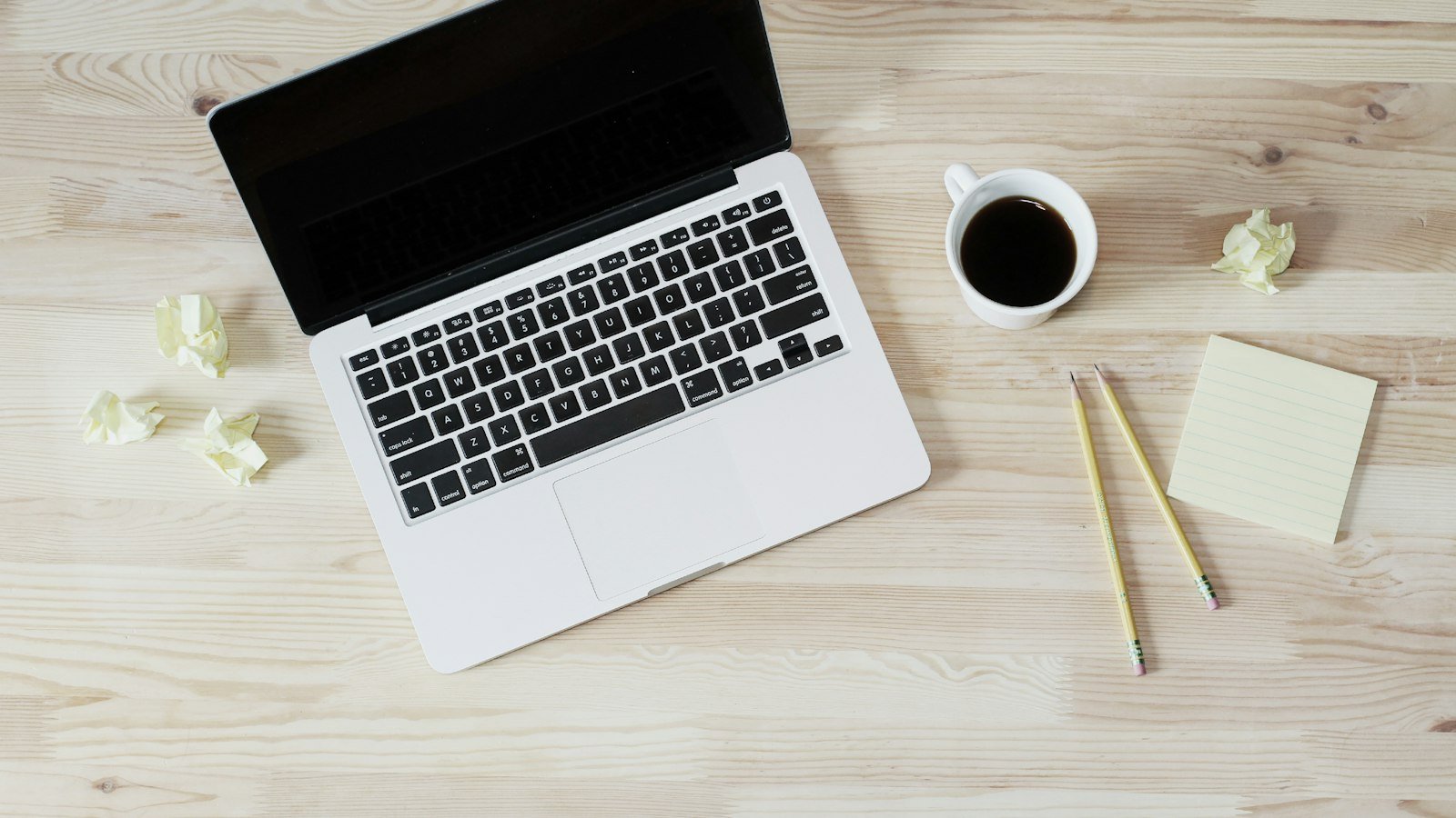 Reseller program: turned off MacBook Pro beside white ceramic mug filled with coffee