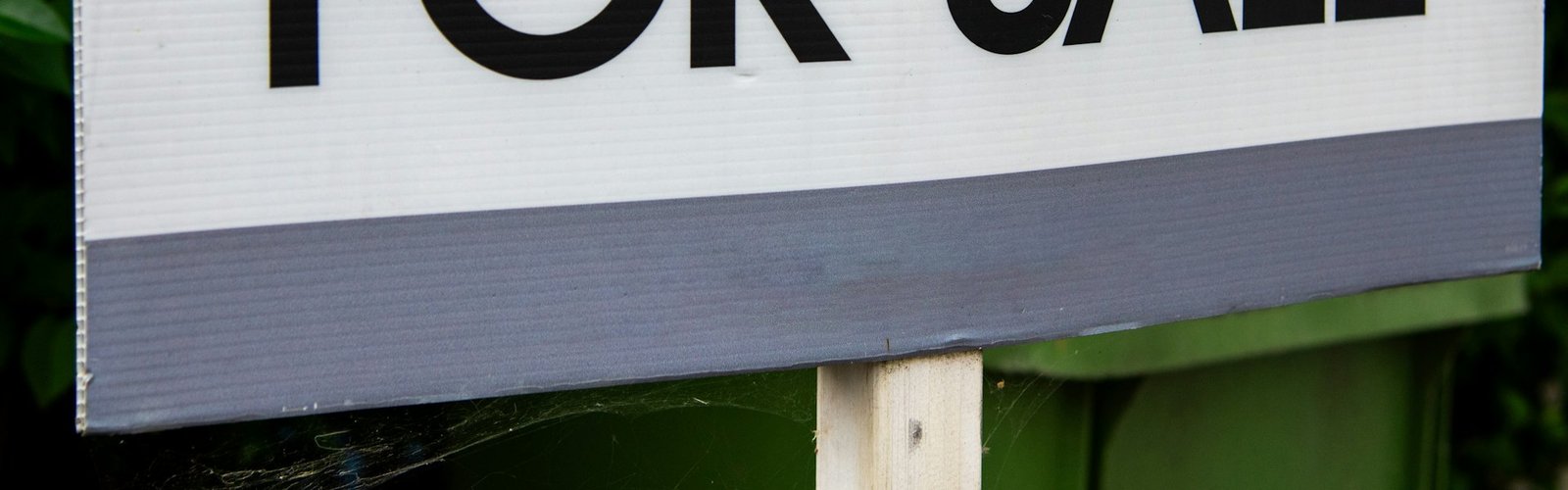 For sale sign in front of a property