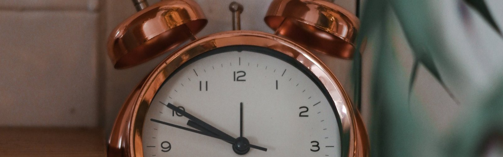 Copper alarm clock showing the time